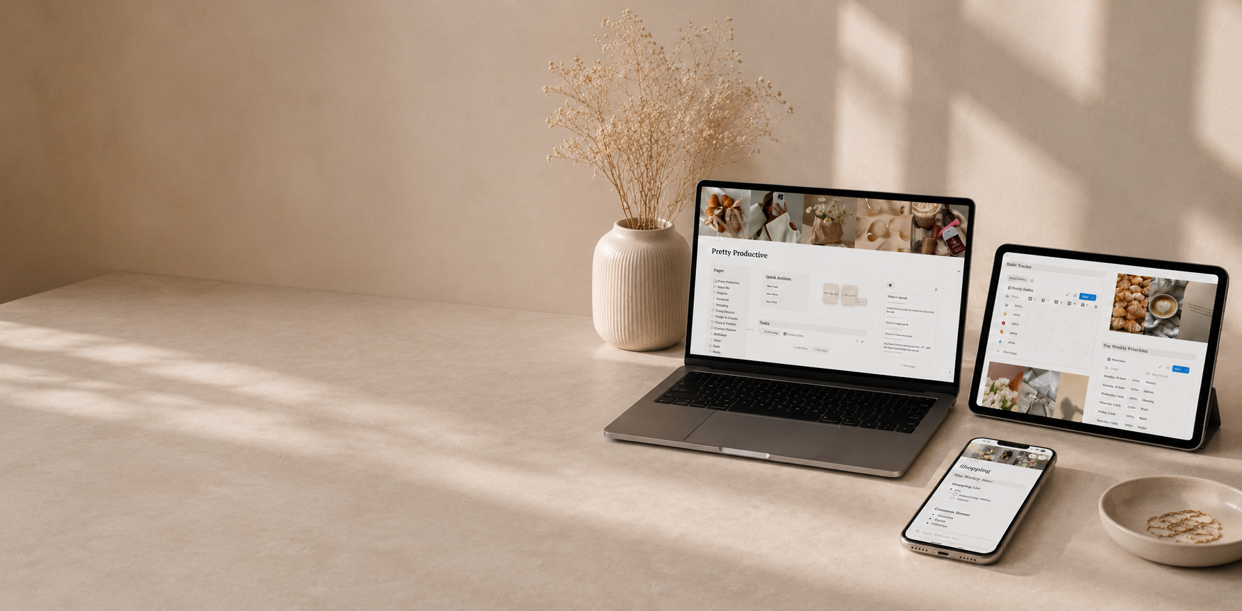 Pretty Productive Notion planner open on MacBook, iPad, and iPhone
on beige desk
